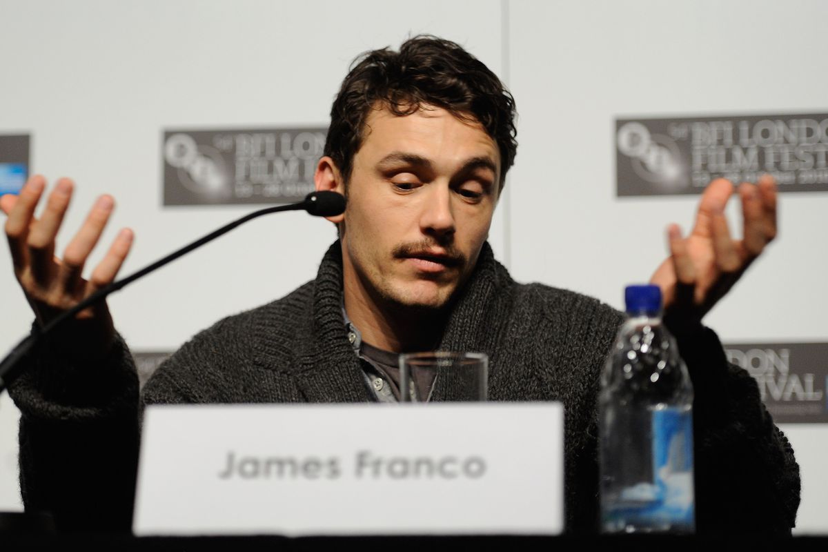 Actor James Franco holds up his hands and shrugs