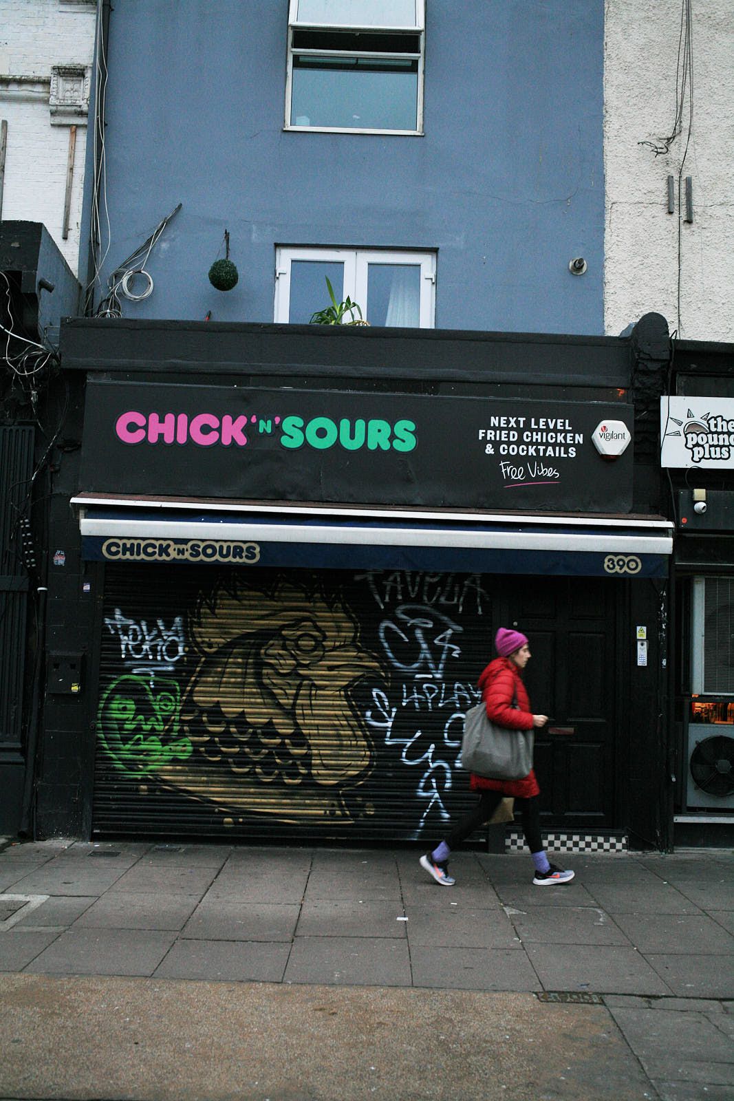 A person walks past Chick ‘n’ Sours which has been shut due to the omicron wave of covid-19 in London