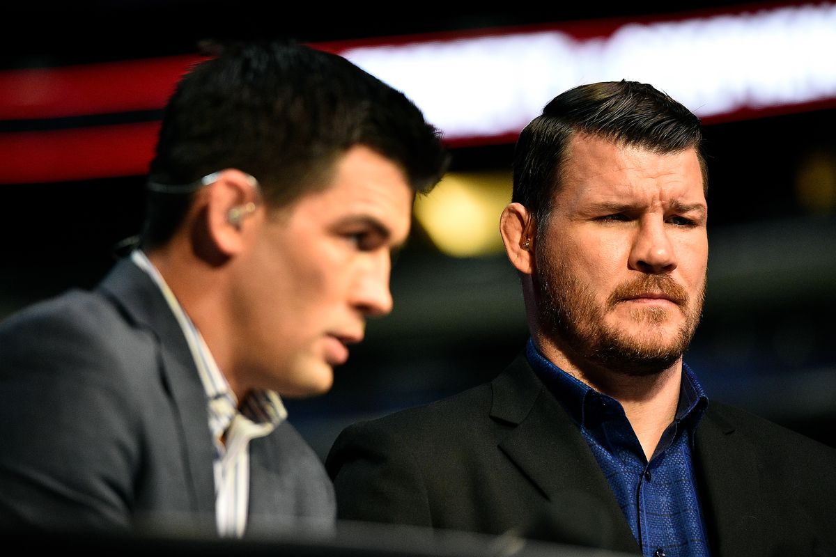 Dominick Cruz and Michael Bisping work the FOX broadcast booth during a 2018 UFC broadcast.