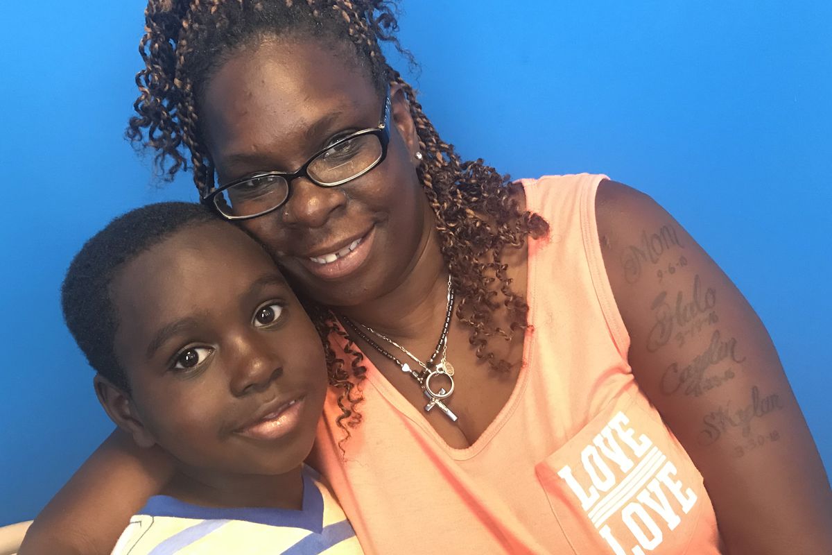 Michael McCall, 7, and his grandmother, Edna Paul, attended a meeting at the Detroit Parent Network to learn more about the third- grade reading law that will go into effect when he's in third grade.