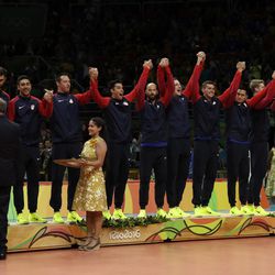 Members of the United States' team stand to receive their bronze medals during an awarding ceremony for men's volleyball at the 2016 Summer Olympics in Rio de Janeiro, Brazil, Sunday, Aug. 21, 2016.
