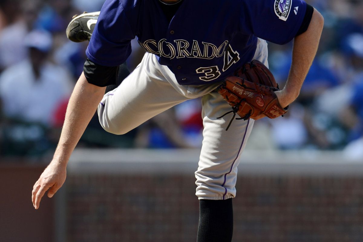 Aug 24, 2012; Chicago, IL, USA; Colorado Rockies relief pitcher Matt Belisle throws a pitch against the Chicago Cubs during the eighth inning at Wrigley Field.  The Cubs won 5-3. Mandatory Credit: Jerry Lai-US PRESSWIRE