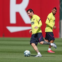 Lionel Messi and Arturo Vidal hard at work