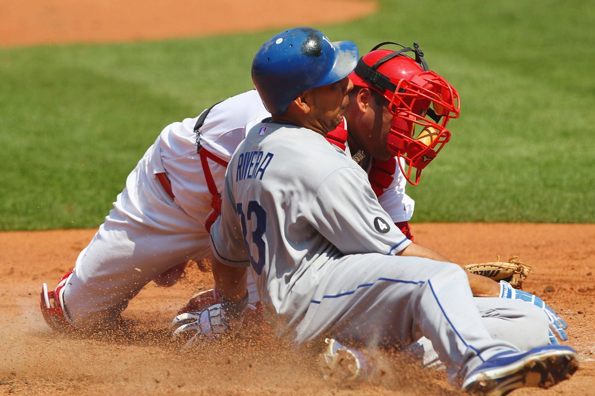 ST. LOUIS, MO - AUGUST 24: Juan Rivera #33 of the Los Angeles Dodgers scores a run against Gerald Laird #13 of the St. Louis Cardinals at Busch Stadium on August 24, 2011 in St. Louis, Missouri.  (Photo by Dilip Vishwanat/Getty Images)