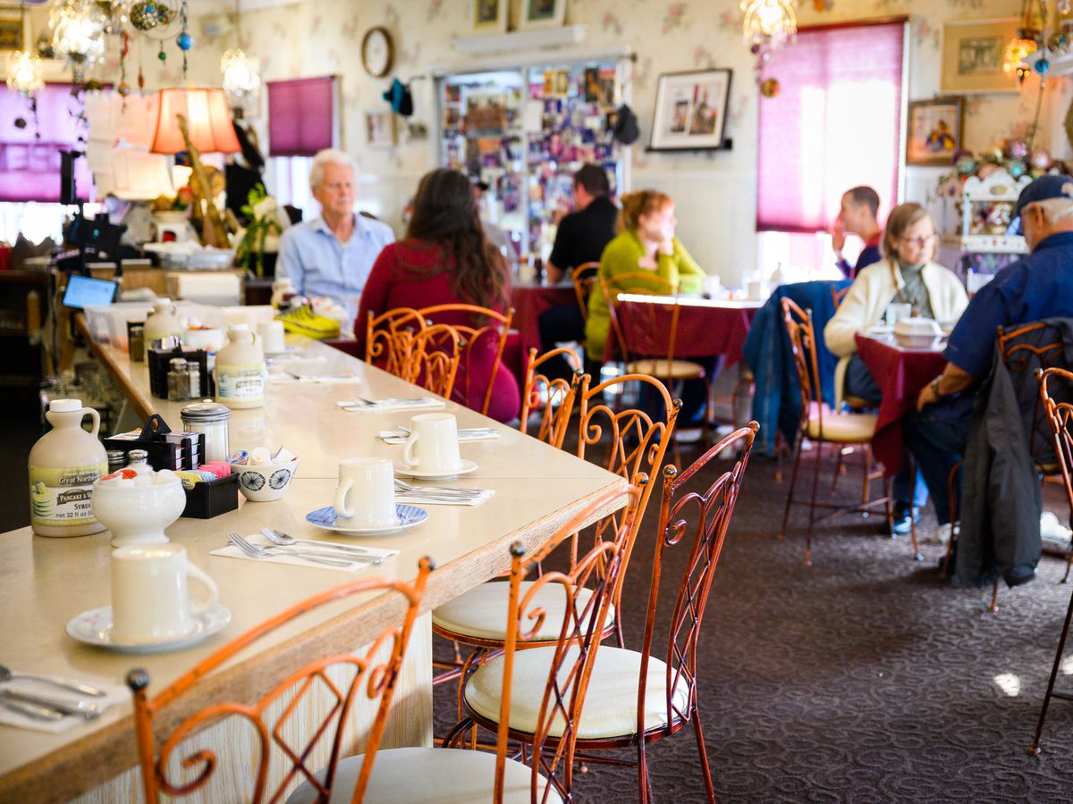 Customers sit and eat within the dining room at Cameo Cafe in Portland, Oregon.