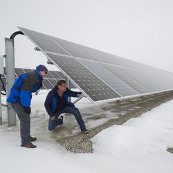 The Idaho National Laboratory's Kurt Fowers checks a solar installation in Utah as part of the U.S. Department of Energy's ongoing collaboration with the military to help generate its own source of power.