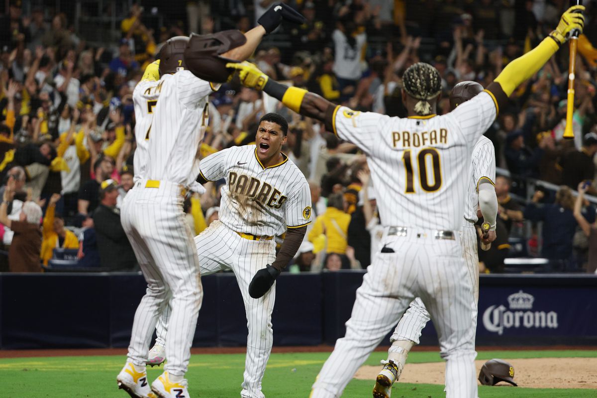 Juan Soto of the San Diego Padres celebrates with teammates after scoring a run during the seventh inning to go up 5-3 against the Los Angeles Dodgers in game four of the National League Division Series at PETCO Park on October 15, 2022 in San Diego, California.