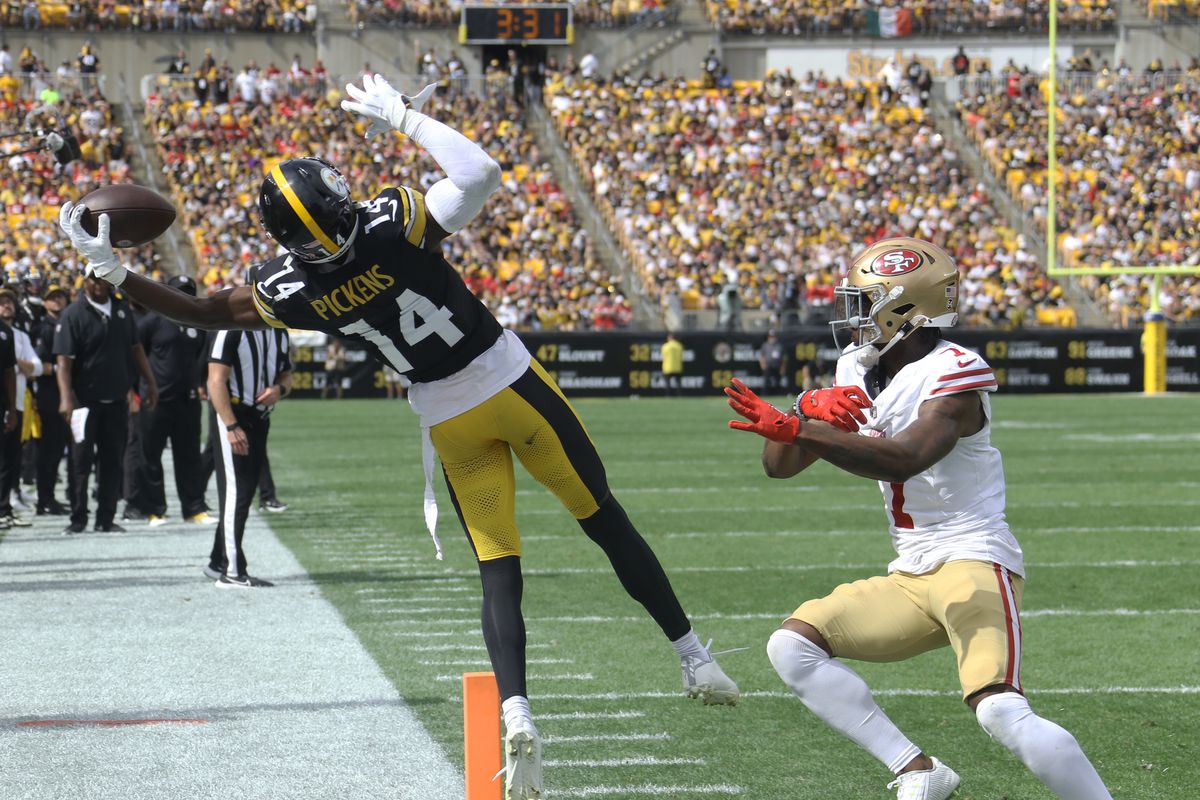Pittsburgh Steelers wide receiver George Pickens (14) makes a catch against San Francisco 49ers cornerback Charvarius Ward (7) but can not stay in bounds during the third quarter at Acrisure Stadium. San Francisco won 30-7. Mandatory Credit: Charles LeClaire