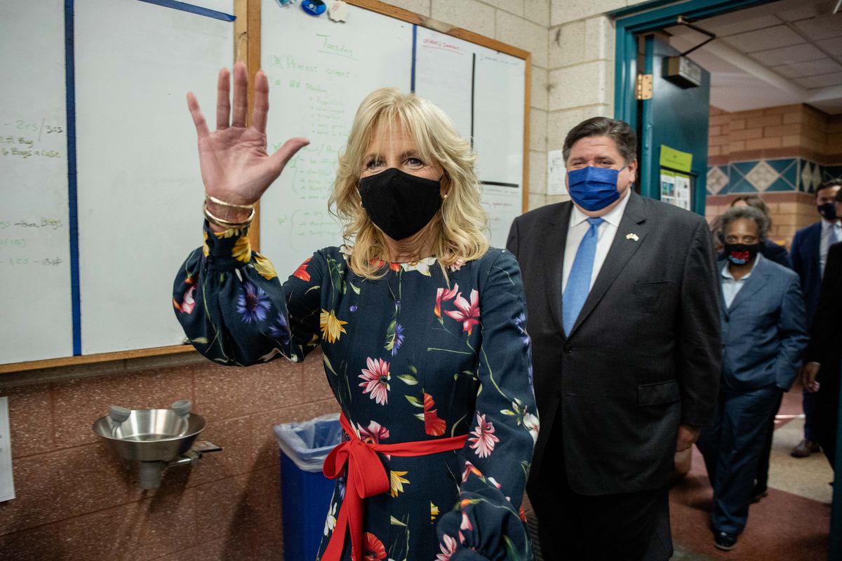 First Lady Jill Biden waves as she, Gov. J.B. Pritzker and Mayor Lori Lightfoot commemorate Hispanic Heritage Month and visit a horticulture classroom during a tour of Arturo Velasquez Institute in Little Village, Wednesday morning, Oct. 13, 2021.
