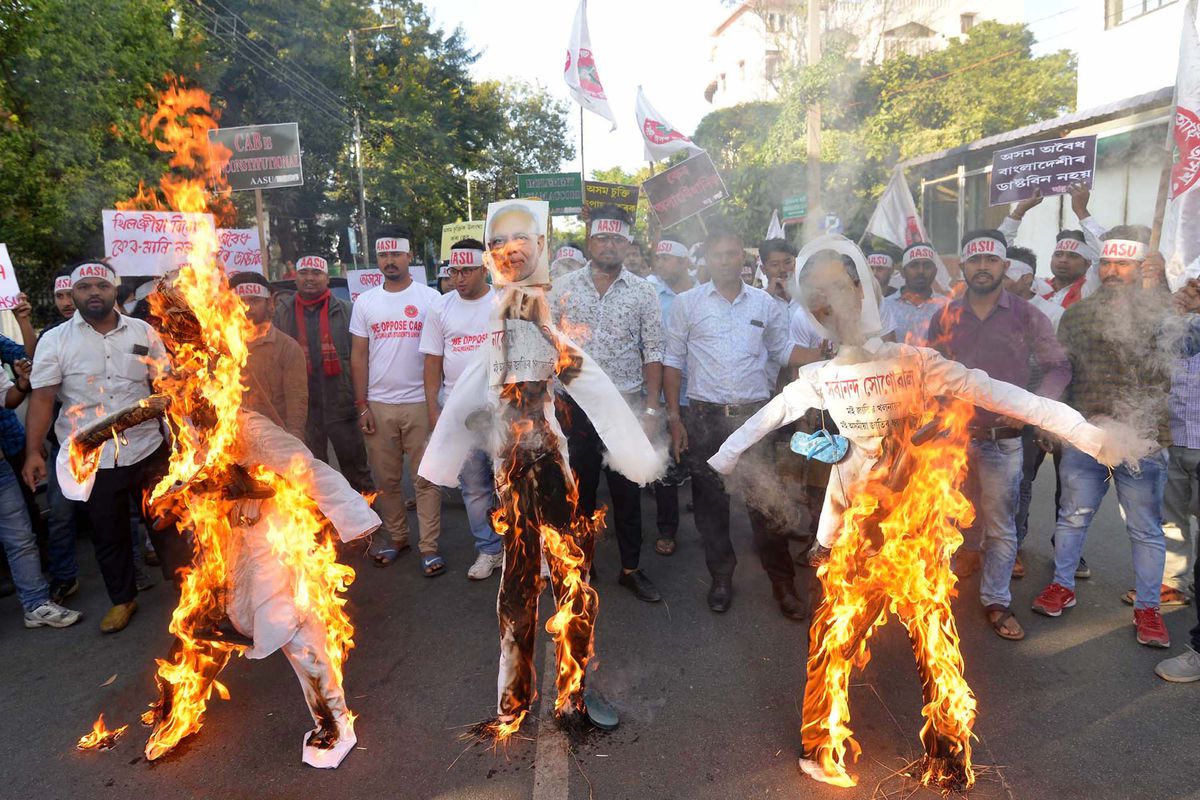 Activists from All Assam Students Union burn effigies of India’s Prime Minister Narendra Modi and others associated with the Citizenship Amendment Bill.