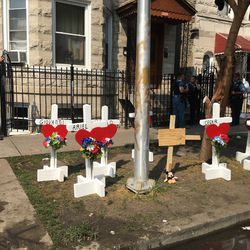 A memorial was placed outside the home where a fire early Sunday took the lives of 10 children. | Rick Majewski/For the Sun-Times