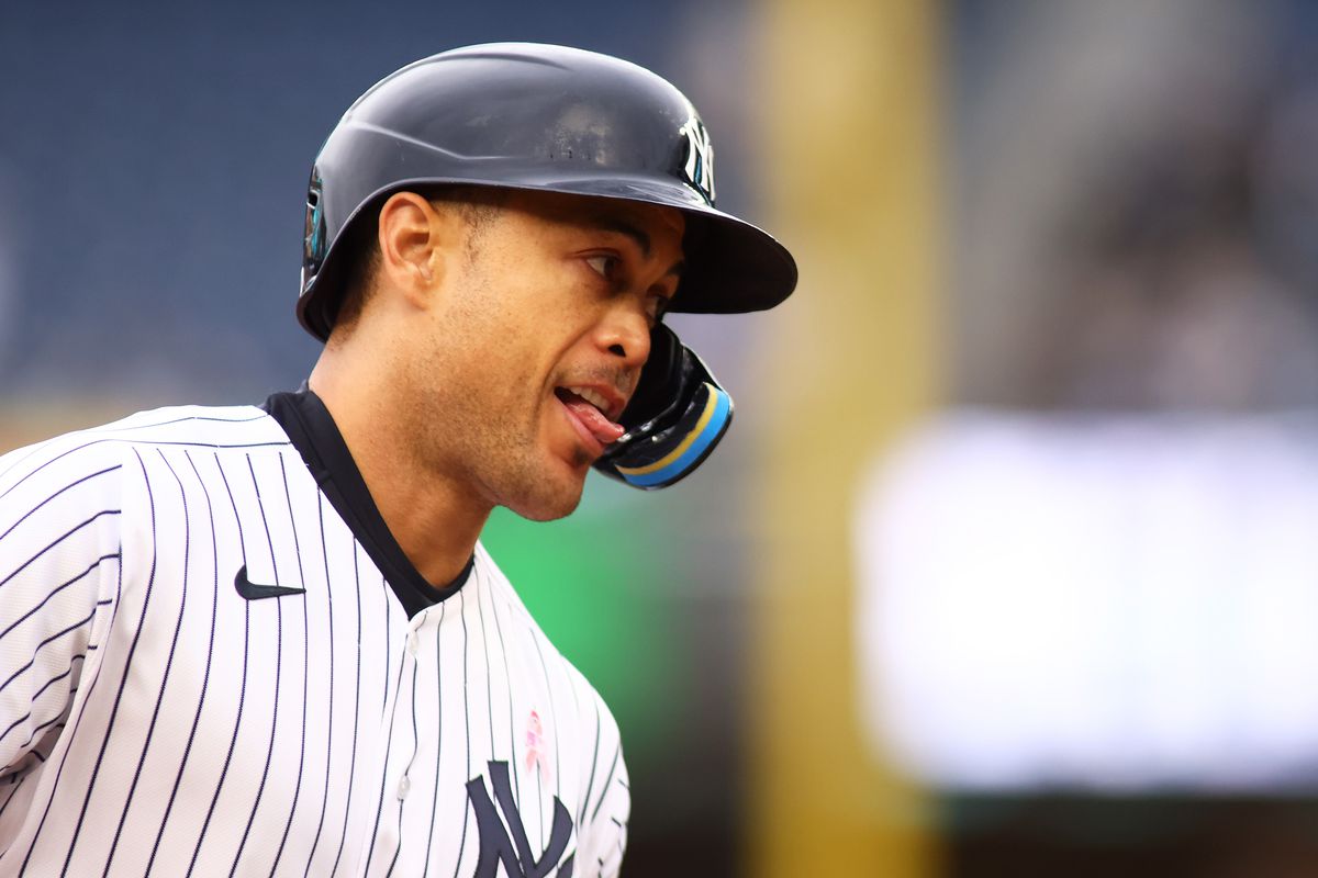 Giancarlo Stanton #27 of the New York Yankees reacts after hitting a two-run home run to center field in the third inning during game two of a doubleheader against the Texas Rangers at Yankee Stadium on May 08, 2022 in New York City.