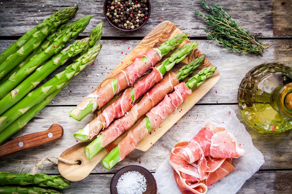 Prosciutto-wrapped asparagus are easily assembled in advance and ready to pop into the oven or on the grill when you are ready to serve. They make a great appetizer to pass around while the rest of your meal is cooking.