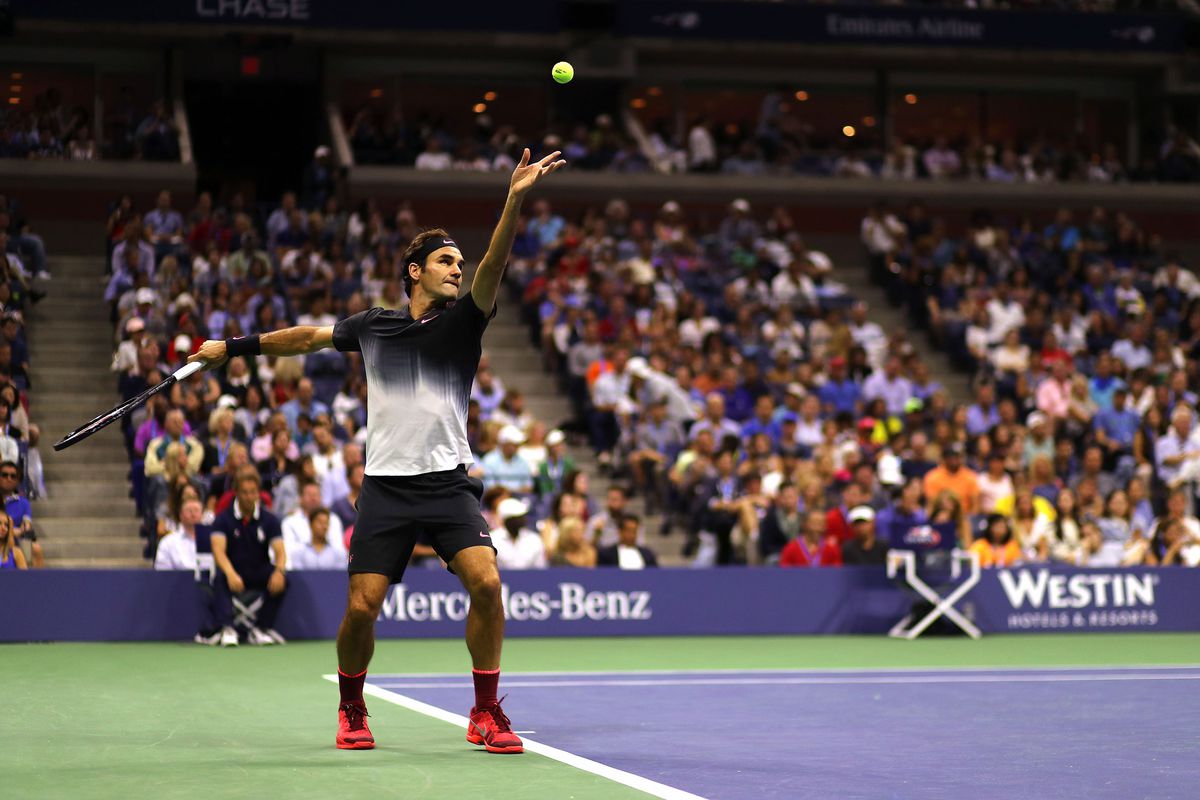 Roger Federer serves during his fourth-round match against Philipp Kohlschreiber