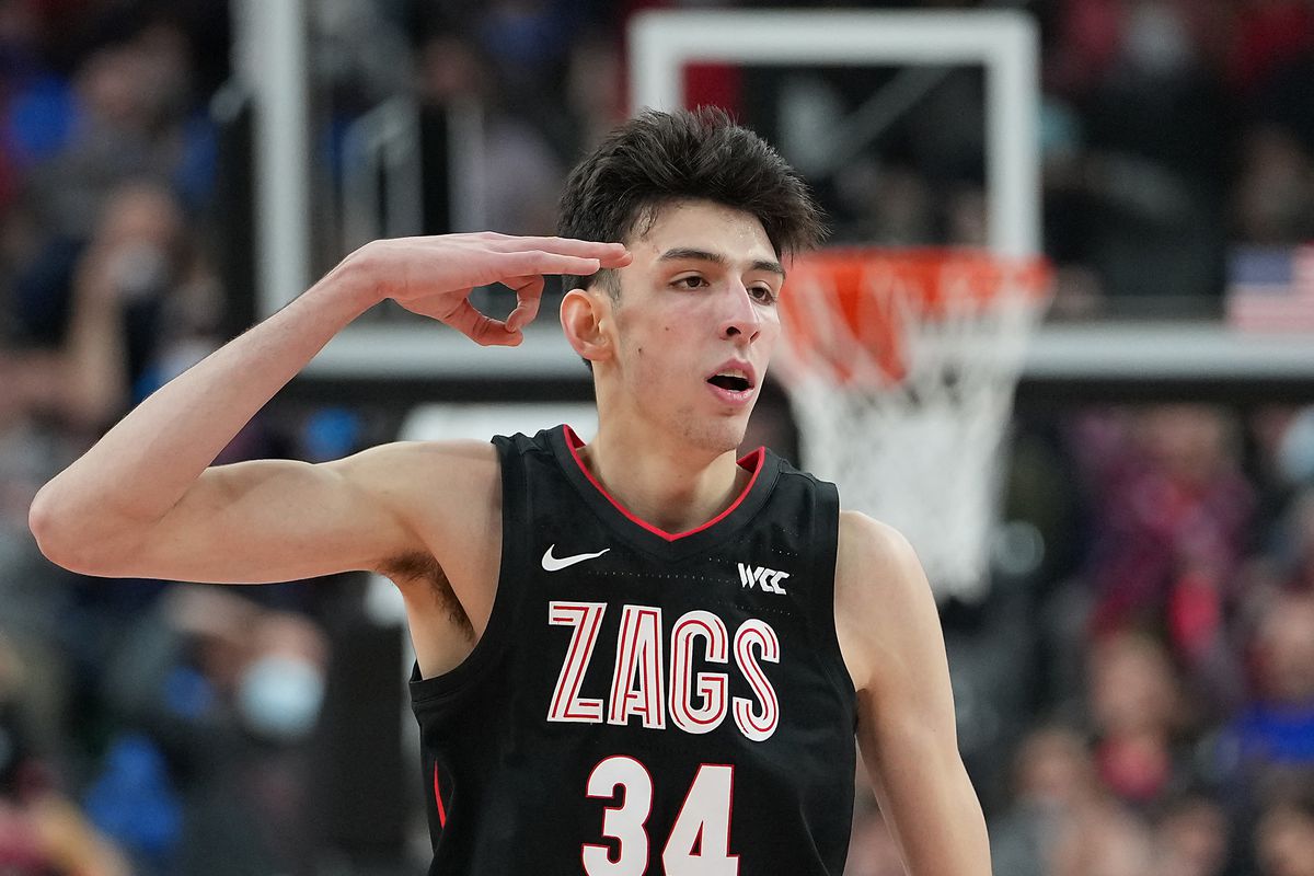 Gonzaga Bulldogs center Chet Holmgren gestures after scoring a three-point bucket against the UCLA Bruins during the second half at T-Mobile Arena.