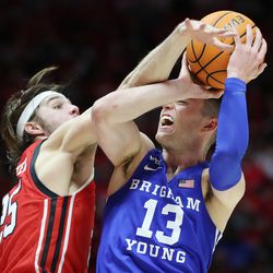 Brigham Young Cougars guard Alex Barcello (13) and Utah Utes guard Rollie Worster (25) compete in Salt Lake City on Saturday, Nov. 27, 2021. BYU won 75-64.