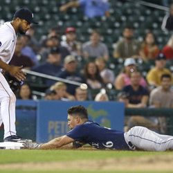 DETROIT, MI - AUGUST 31: Adam Frazier #26 of the Seattle Mariners beats the throw to third baseman Jeimer Candelario #46 of the Detroit Tigers to stretches a hit into a triple during the seventh inning at Comerica Park on August 31, 2022, in Detroit, Michigan.