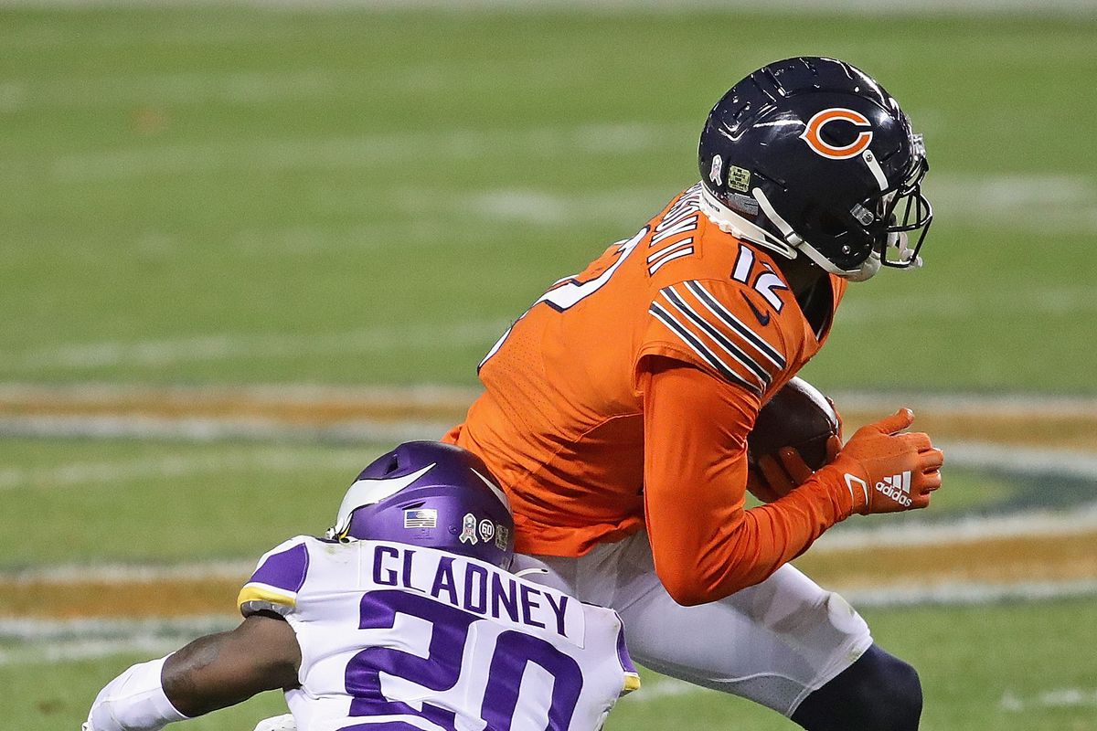 Jeff Gladney #20 of the Minnesota Vikings hits Allen Robinson #12 of the Chicago Bears at Soldier Field on November 16, 2020 in Chicago, Illinois.