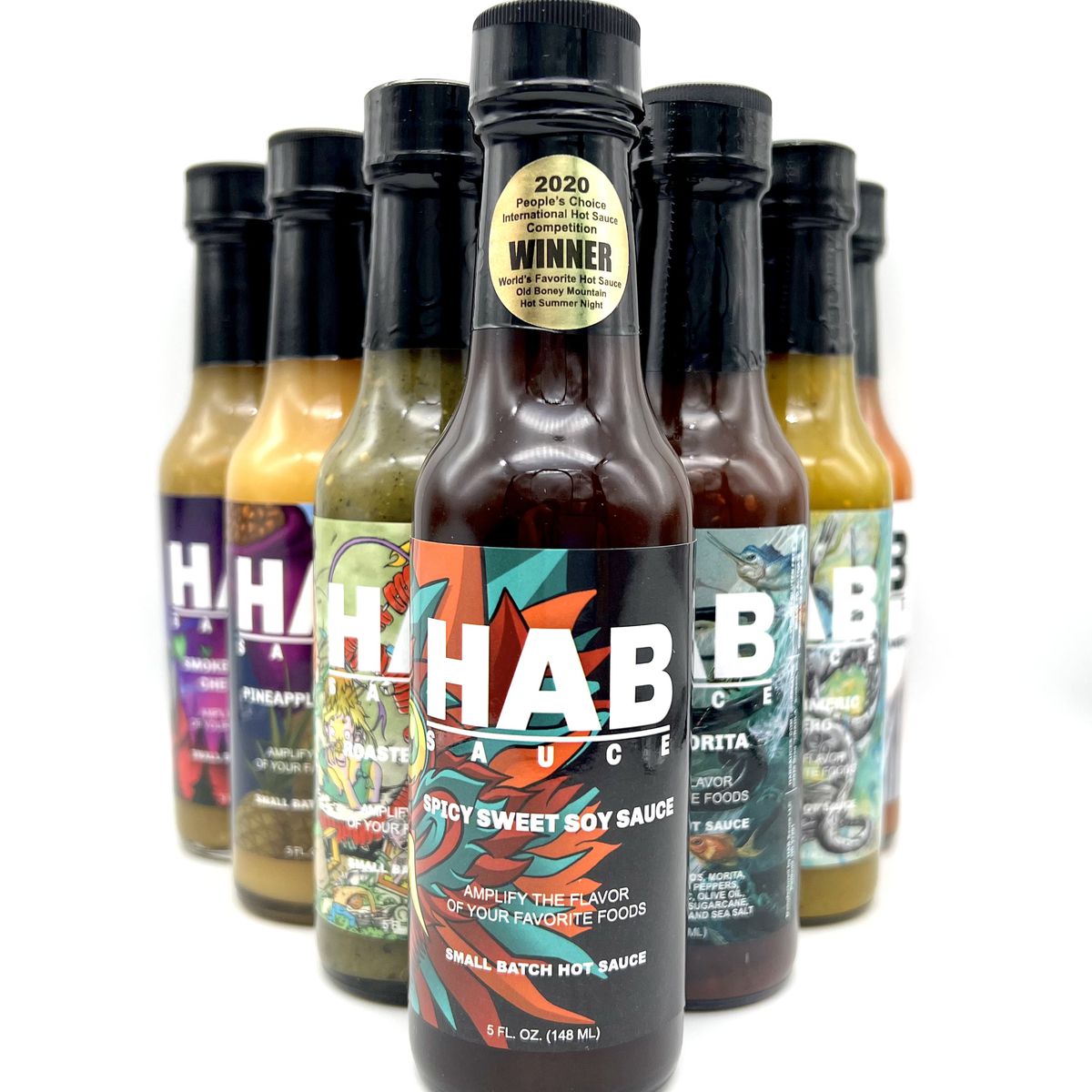 A triangle of sauces come with labels that read “HAB Sauce”