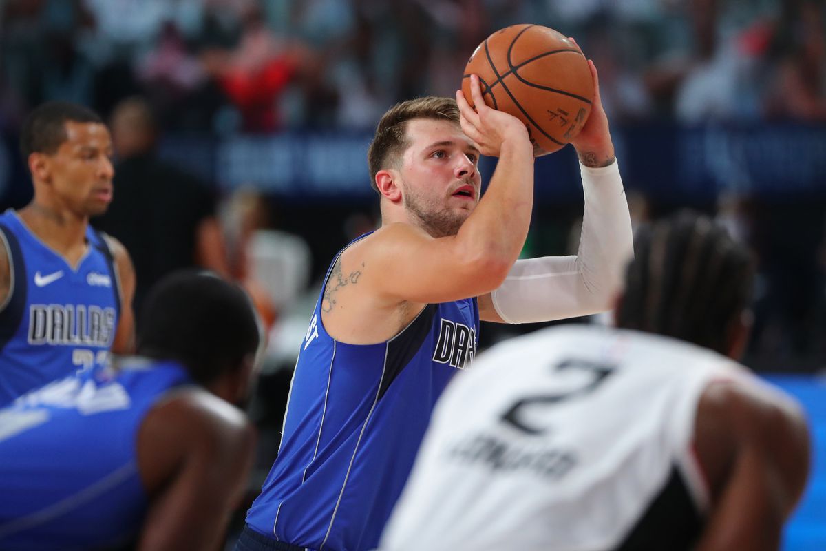 Luka Doncic of the Dallas Mavericks shoots a free throw against the LA Clippers during Round One Game Five of the NBA Playoffs on August 25, 2020 at The AdventHealth Arena at ESPN Wide World Of Sports Complex in Orlando, Florida.