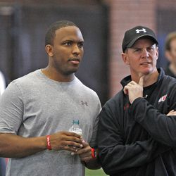 Utah assistant coaches Brian Johnson, left, and Jay Hill at Utah Pro Day where departing University of Utah senior football players and some invitees work out for NFL scouts in Spence Eccles Field House Friday, March 23, 2012, in Salt Lake City, Utah.   
