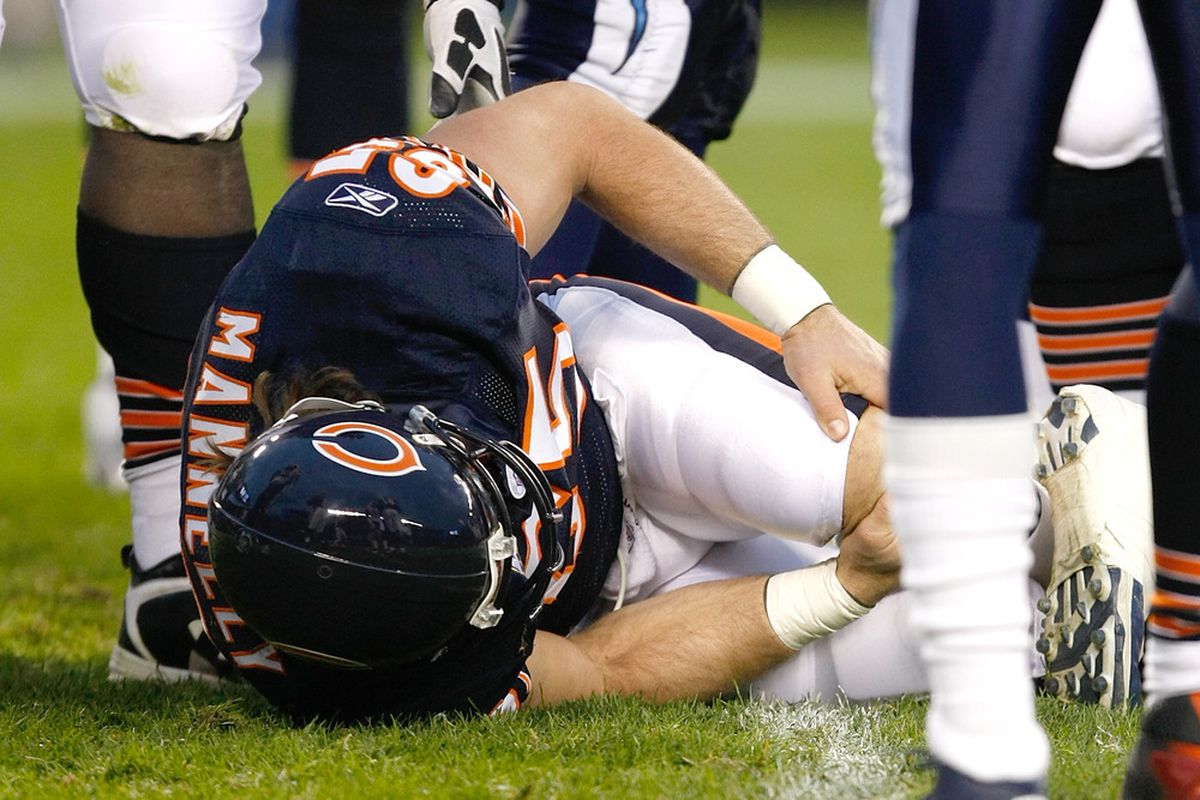 CHICAGO, IL - NOVEMBER 20: Patrick Mannelly #65 of the Chicago Bears lays on the field injured during the game against the San Diego Chargers at Soldier Field on November 20, 2011 in Chicago, Illinois. (Photo by Scott Boehm/Getty Images)