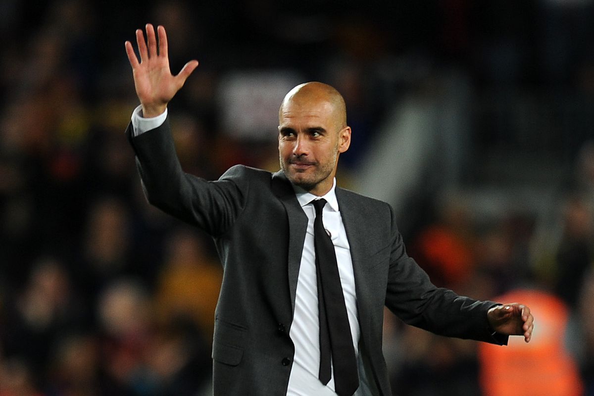 Guardiola gestures to the crowd after co