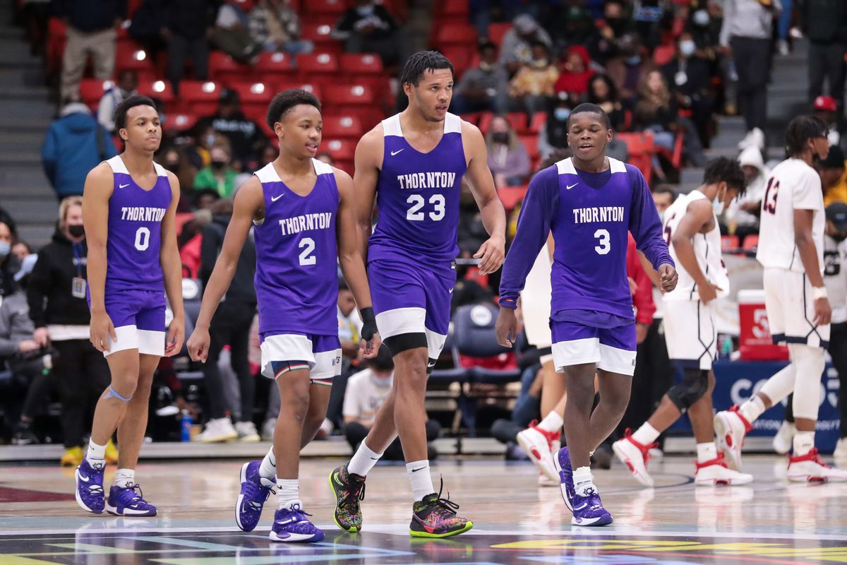 Thornton’s Ty Rodgers (23), Vincent Rainey (2), Wadell Bell (3) and Ariohn Herring (0) return to their team after winning the game against St Rita.