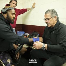 Stitch Duran wrapping the hands of Arnold Allen before Bare Knuckle FC at Cheyenne Ice & Events Center in Wyoming.