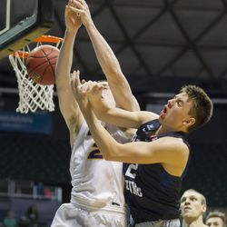 Northern Iowa forward Klint Carlson (2) battles BYU guard Zac Seljaas, right, for control of a rebound in the second half of an NCAA college basketball game at the Diamond Head Classic, Friday, Dec. 25, 2015, in Honolulu. BYU won 84-76. (AP Photo/Eugene Tanner)