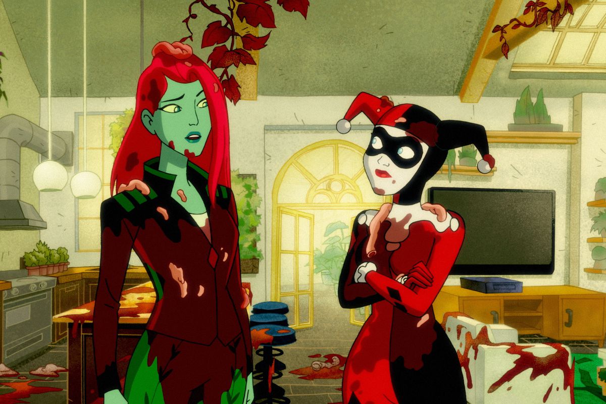 Poison Ivy and Harley Quinn stand and look at each other