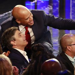 Democratic presidential candidate Sen. Cory Booker, D-N.J., takes a selfie with a supporter at the end of a Democratic primary debate hosted by NBC News at the Adrienne Arsht Center for the Performing Arts, Thursday, June 27, 2019, in Miami. (AP Photo/Wilfredo Lee)
