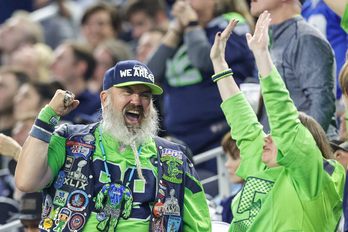 Seattle Seahawks fans celebrate a touchdown during the game between the Dallas Cowboys and the Seattle Seahawks on November 30, 2023 at AT&amp;T Stadium in Arlington, Texas.