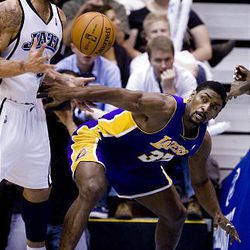 Utah's Carlos Boozer comes up with a loose ball from the Lakers' Ron Artest as the Utah Jazz host L.A. at EnergySolutions Arena on Wednesday. Los Angeles won 96-81.