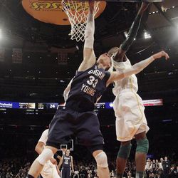 Brigham Young Cougars forward Nate Austin (33) has his shot blocked by Baylor Bears forward Cory Jefferson (34) during the NIT Final Four in New York City Tuesday, April 2, 2013. BYU lost 76-70.