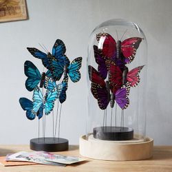 Butterflies on Stand, <a href="http://www.westelm.com/products/butterflies-on-stand-d1893/?pkey=e|butterfly|7|best|0|1|24||6&cm_src=PRODUCTSEARCH||NoFacet-_-NoFacet-_-NoMerchRules-_-">$24</a>