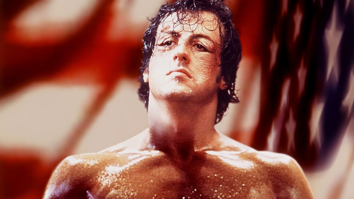 Rocky (Stallone), sweaty and bruised.