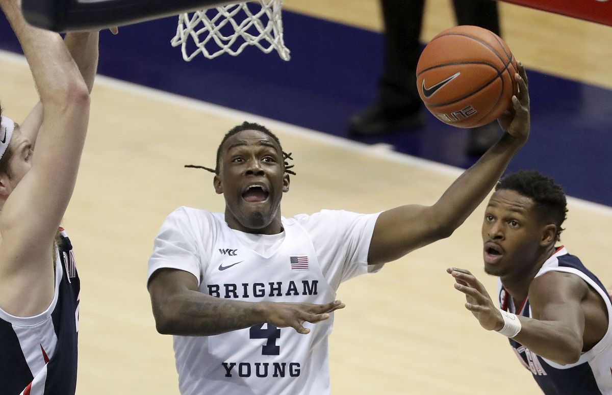 Brigham Young Cougars guard Brandon Averette (4) shoots as Gonzaga Bulldogs guard Joel Ayayi (11) watches during a basketball game at the Marriott Center in Provo on Monday, Feb. 8, 2021. BYU lost 71-82.