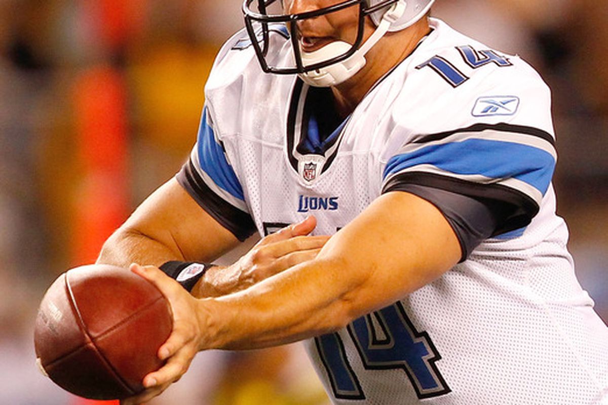 Quarterback Shaun Hill hands the ball off in the first game of the preseason for the Detroit Lions.