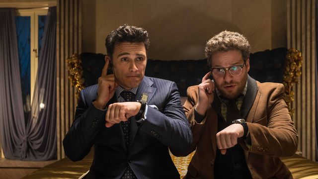 james franco and seth rogen check their ear pieces in the interview