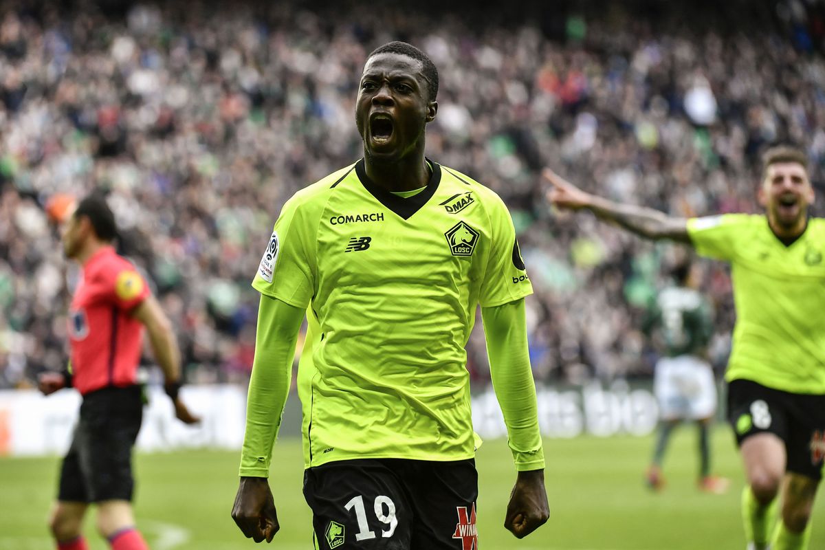 FBL-FRA-LIGUE1-SAINT ETIENNE-LILLE
Lille's Ivorian forward Nicolas Pepe celebrates after scoring a goal during the L1 football match AS Saint-Etienne (ASSE) vs Lille (LOSC) on March 10, 2019, at the Geoffroy Guichard Stadium in Saint-Etienne, central France. (Photo by JEFF PACHOUD / AFP)
