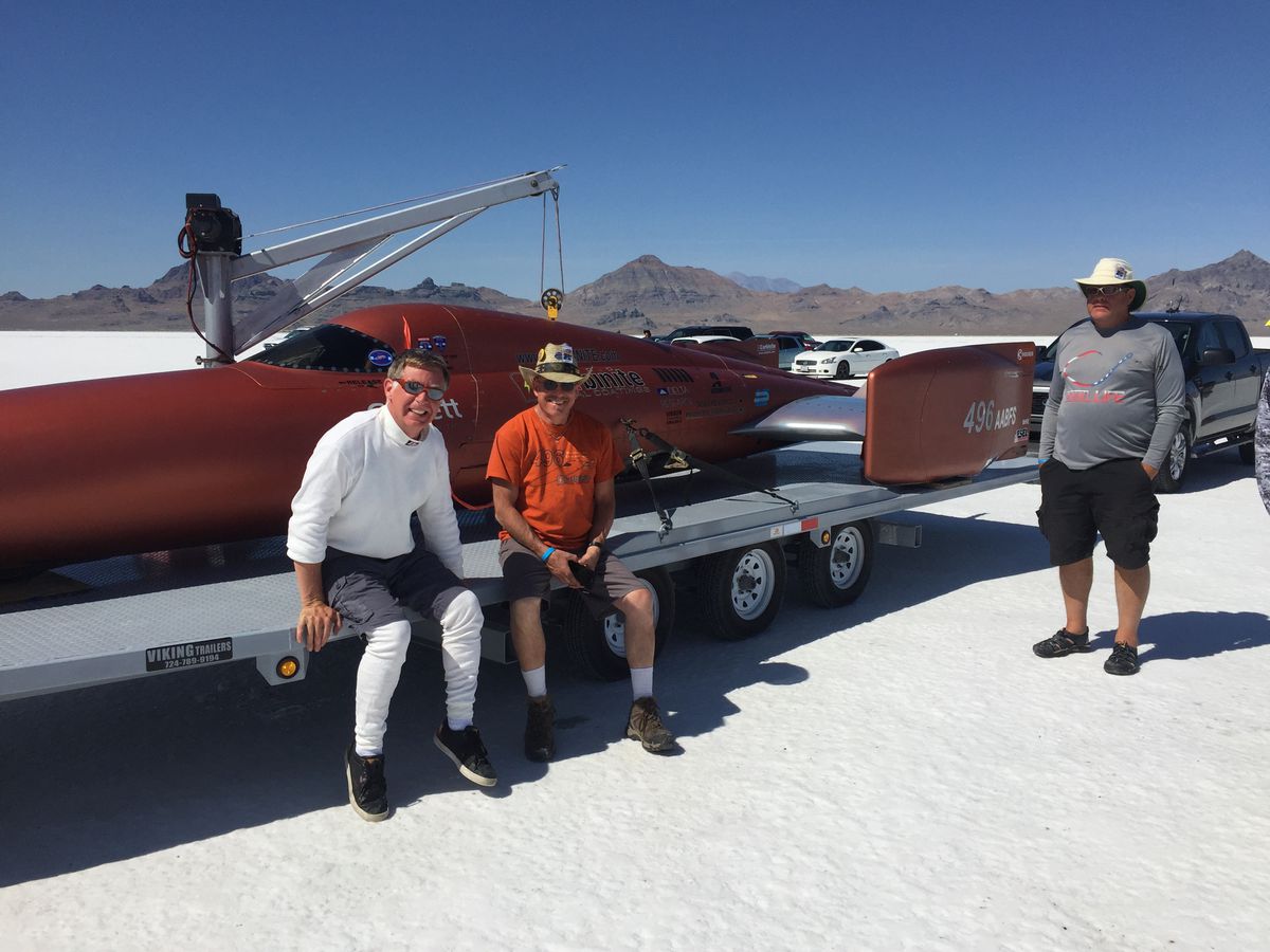 Rob Freyvogel, center, and members of his team pose with his custom speed vehicle,&nbsp;the Carbiliner.&nbsp;Freyvogel was injured during the World of Speed event at the Bonneville Salt Flats attempting to take the car to 500 mph.