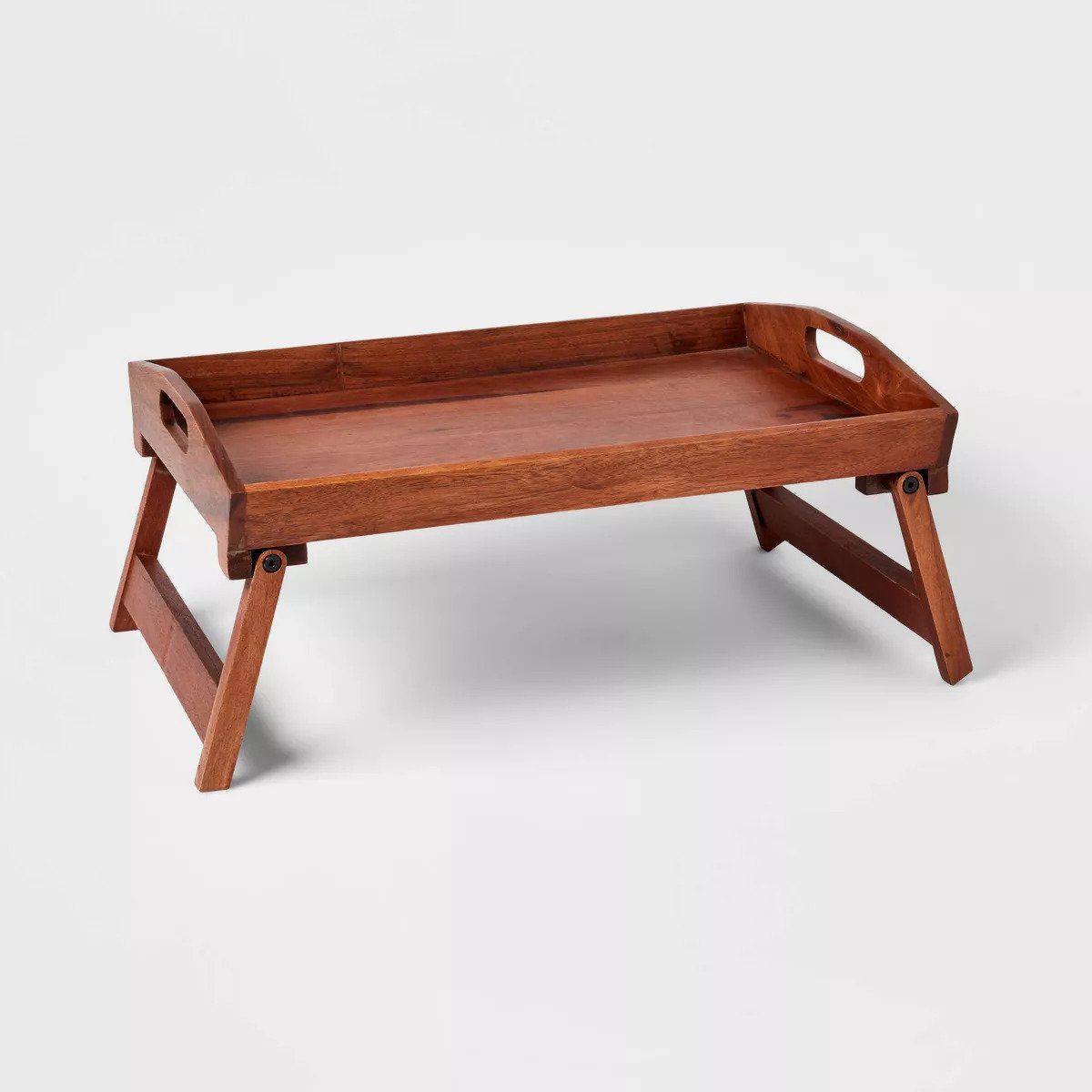 A wood bed tray.