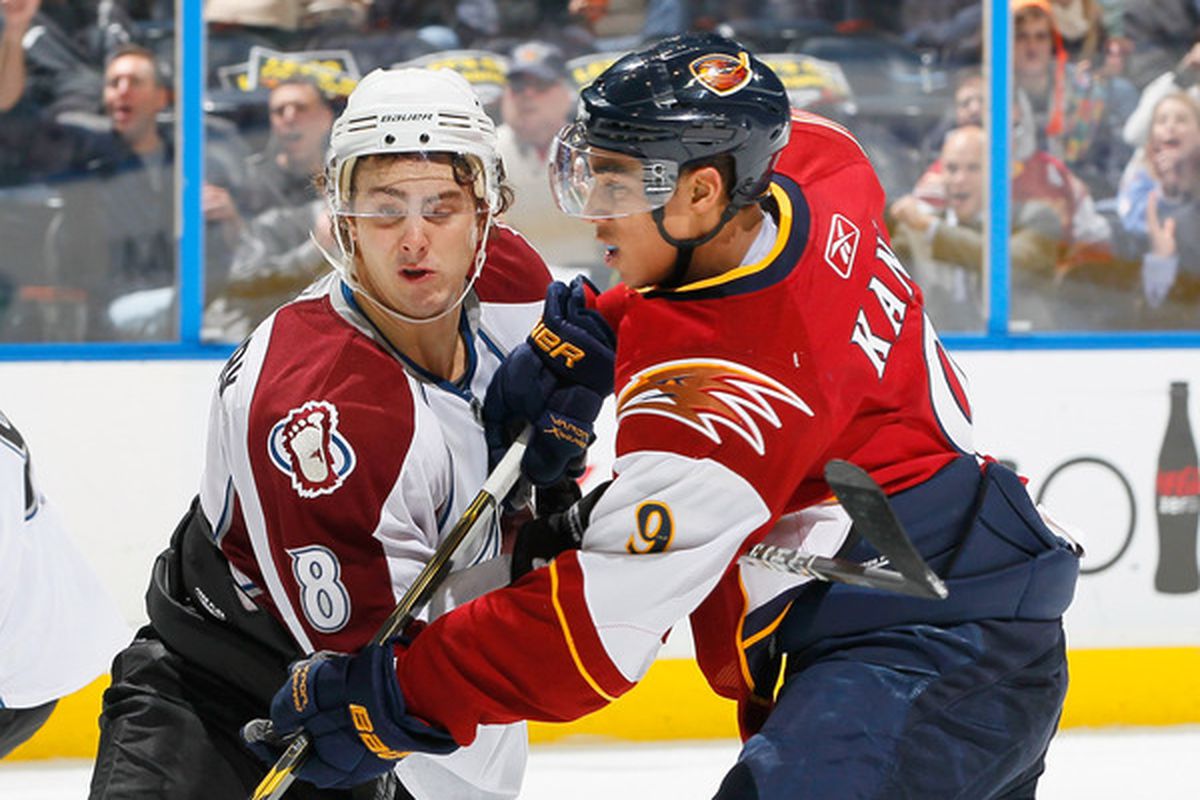 ATLANTA GA - DECEMBER 10:  Evander Kane #9 of the Atlanta Thrashers squares off against Kevin Shattenkirk #8 of the Colorado Avalanche at Philips Arena on December 10 2010 in Atlanta Georgia.  (Photo by Kevin C. Cox/Getty Images)