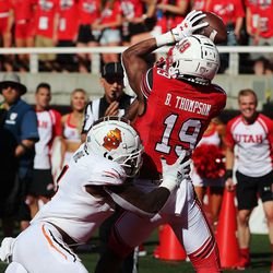 Utah Utes wide receiver Bryan Thompson pulls in a touchdown pass against Idaho State Bengals defensive back Jay Irvine during NCAA football in Salt Lake City on Saturday, Sept. 14, 2019.