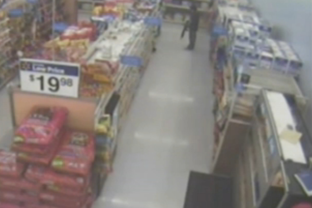 Walmart surveillance footage shows Crawford wasn't brandishing his gun.