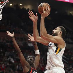 Utah Jazz center Rudy Gobert shoots over Portland Trail Blazers forward Tony Snell during the first half of an NBA basketball game in Portland, Ore., Wednesday, Dec. 29, 2021. 