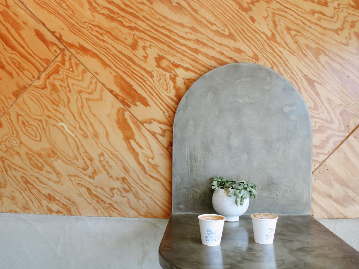 Two cups of coffee in a minimalist coffee shop, Vacancy.