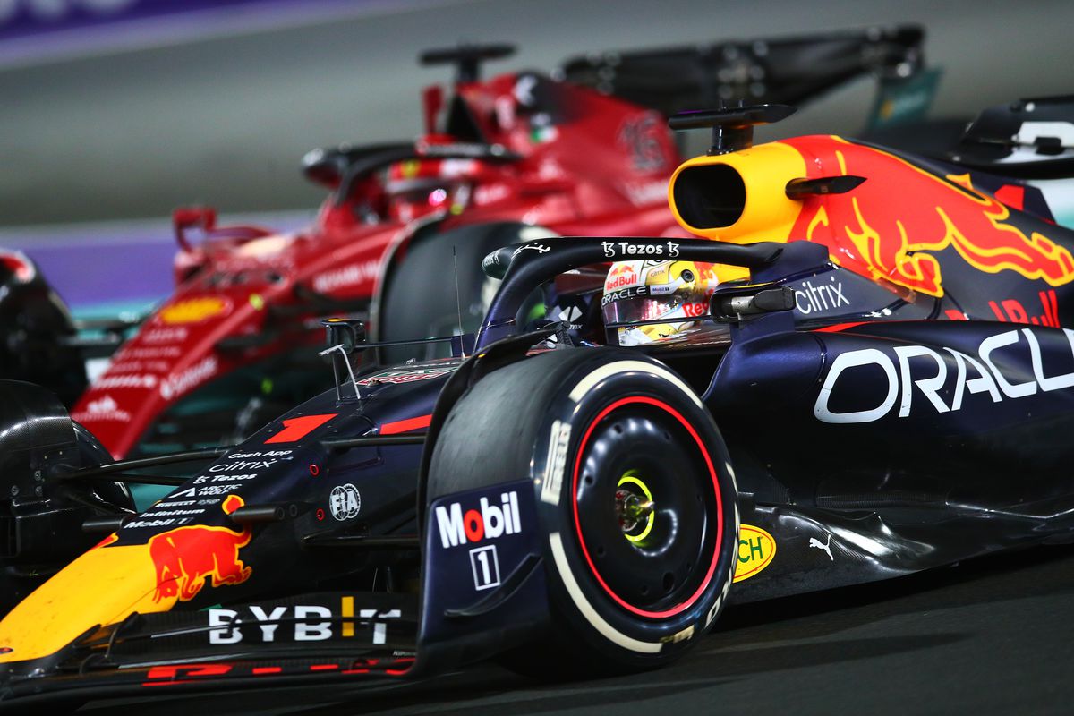 Max Verstappen of the Netherlands driving the (1) Oracle Red Bull Racing RB18 Honda overtakes Charles Leclerc of Monaco driving (16) the Ferrari F1-75 during the F1 Grand Prix of Saudi Arabia at the Jeddah Corniche Circuit on March 27, 2022 in Jeddah, Saudi Arabia.