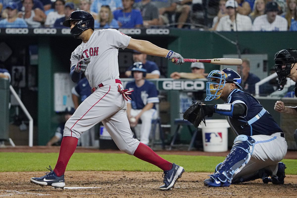 Xander Bogaerts of the Boston Red Sox hits an RBI single in the fifth inning against the Kansas City Royals at Kauffman Stadium on August 05, 2022 in Kansas City, Missouri.